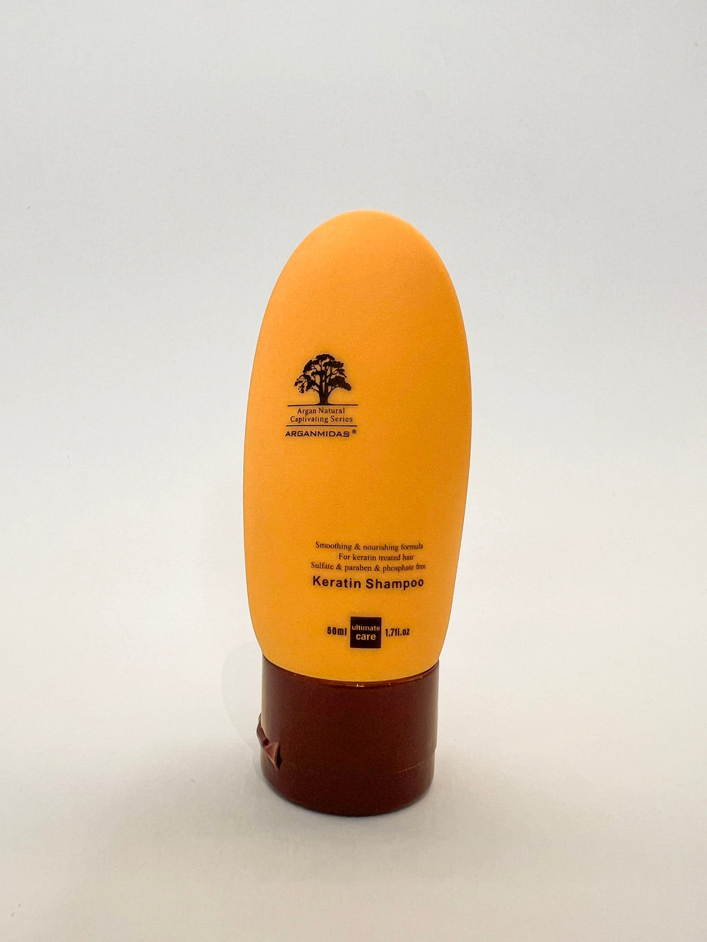 keratin shampoo bottle with brown base on a white background